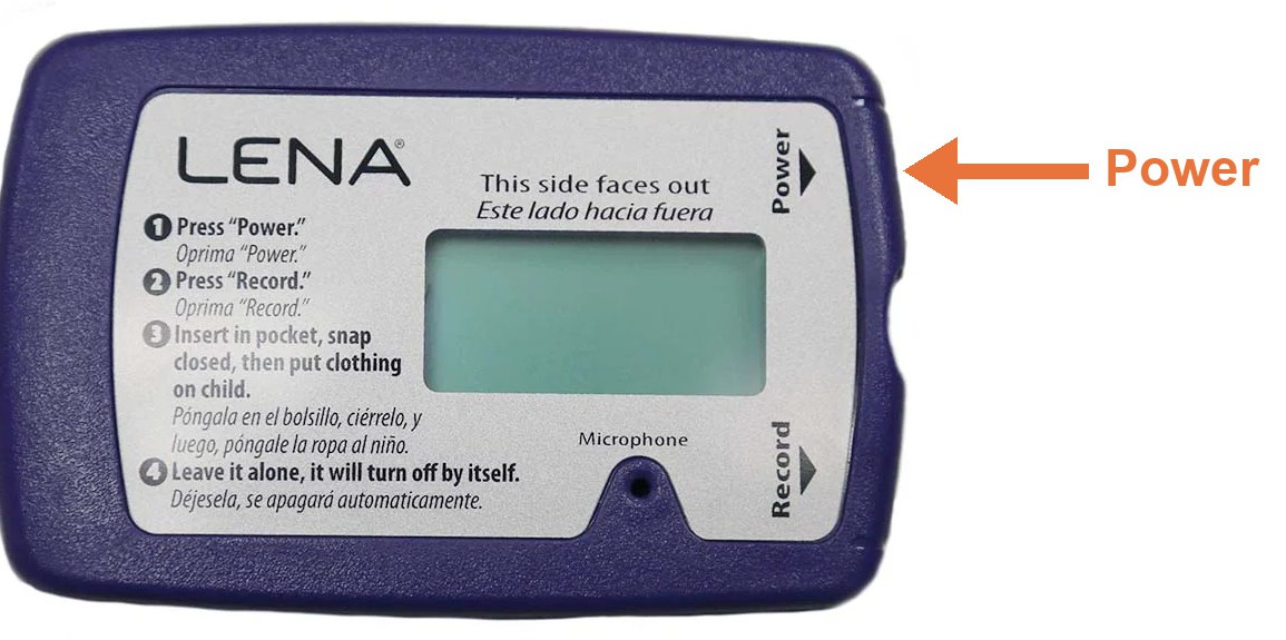 The LENA recorder with an arrow pointing to the Power button on its upper right edge