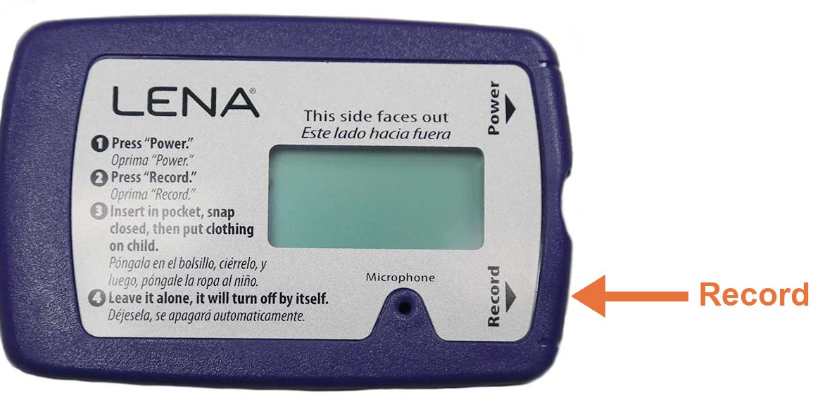 The LENA recorder with an arrow pointing to the Record button on its lower right edge